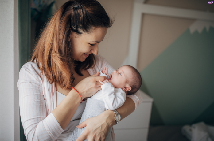 Mother and baby experiencing a strong mother-child bond through touch and nurturing care