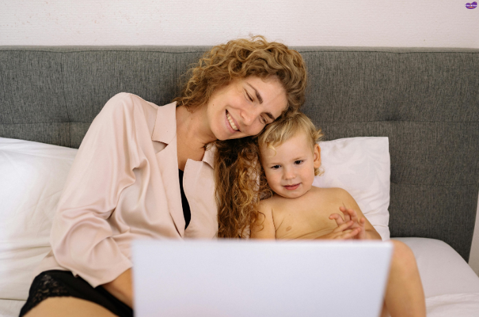 Mother and child bonding while preparing for the first day at school at home