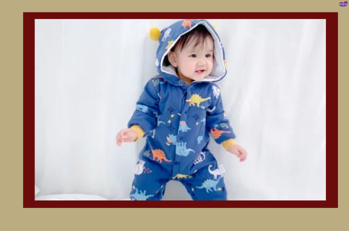 Baby wearing a warm insulated romper as part of baby winter dresses collection for cozy winter comfort