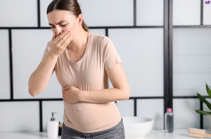 Pregnant woman experiencing morning sickness, one of the best and worst parts of pregnancy.