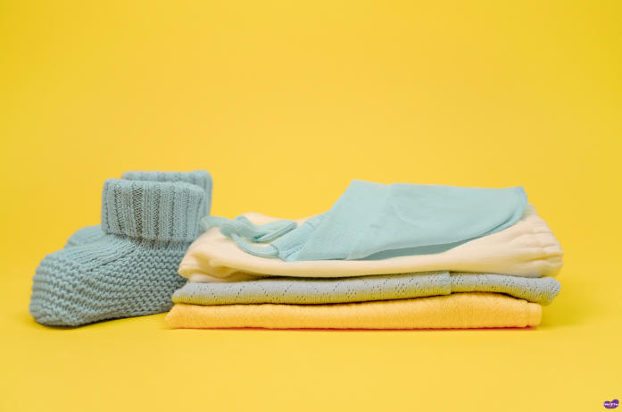 Soft socks and booties to keep newborn feet warm, an essential clothing item for newborn care.