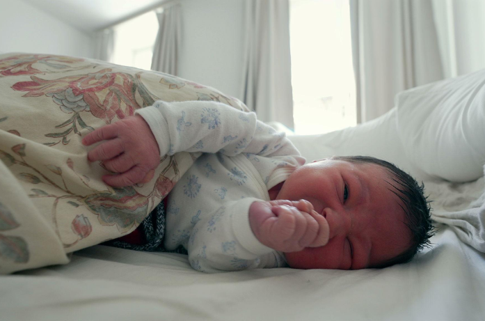 Newborn Grunting in Sleep