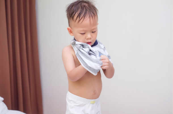 toddler uncomfortable in tight clothing