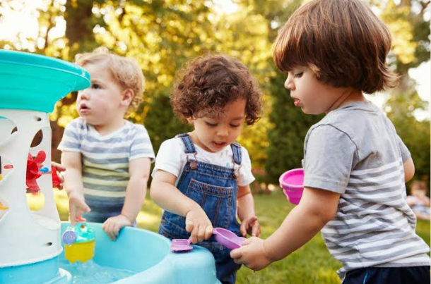 when do babies play with other babies
