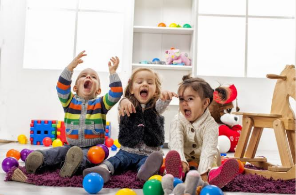 when do babies play with other babies